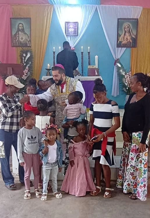 Children and faithful gathered in the mission chapel.
